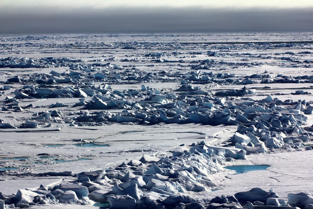 Pack ice near the North pole, hummocky polar ice. Polar day at the lowest position of the sun in late June