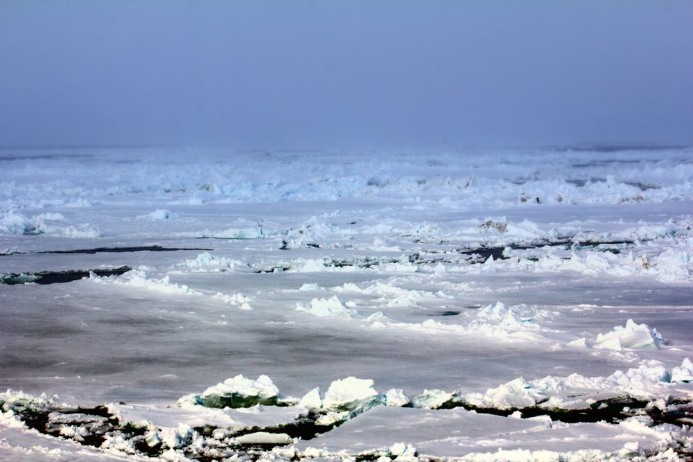 ice at North pole and near (from 88 to 90 degrees). Rare now perennial ice broken by nuclear icebreaker. Broken ice behind (channel), expedition to North pole