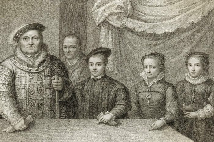 Figure stands holding a scroll, surrounded by individuals in period clothing, against a textured draped background.