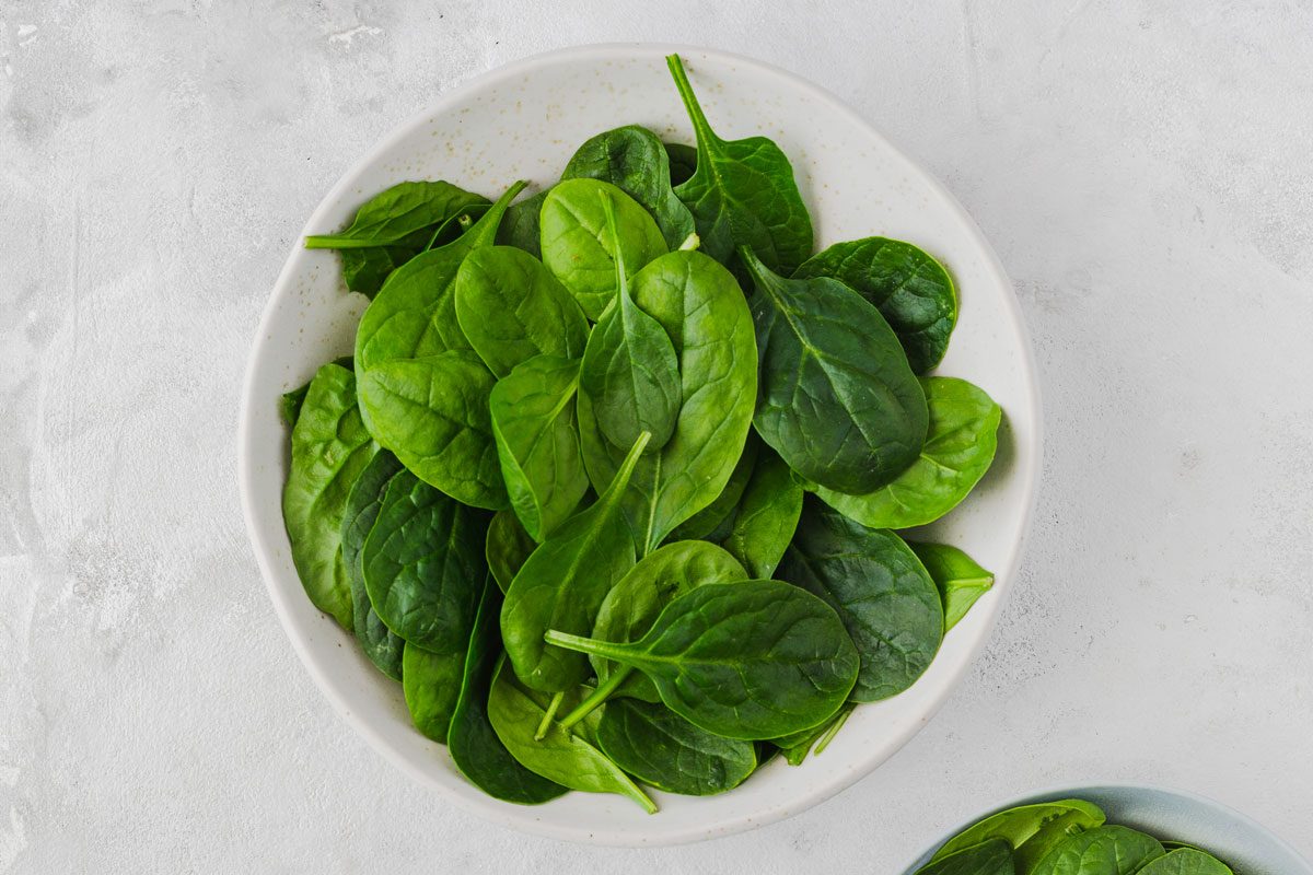 Bowls With Spinach Leaves