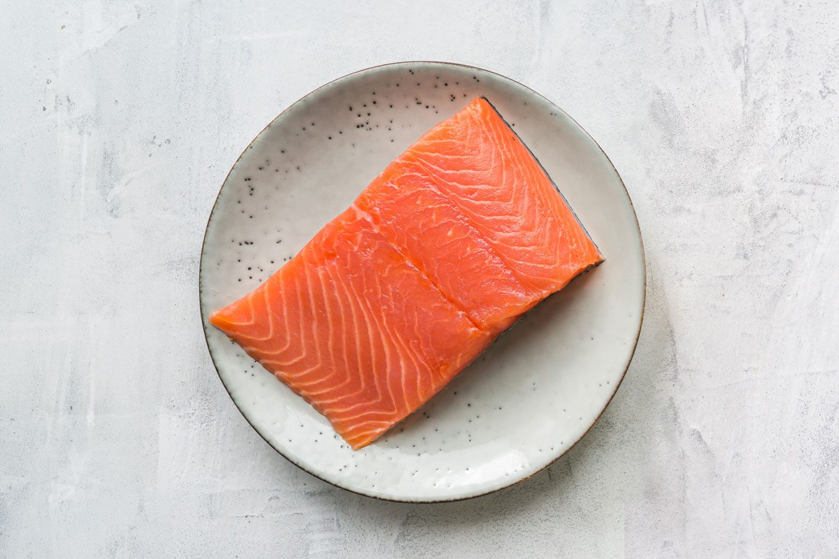 Fresh Salmon Steak On Rustic Plate