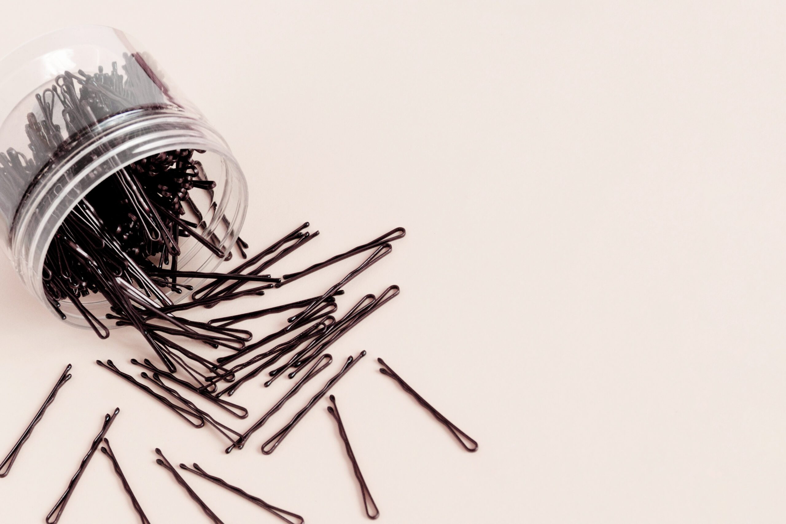 Round container with bobby hair pins
