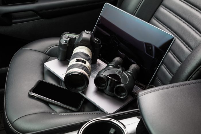 Private investigator tools on car seat