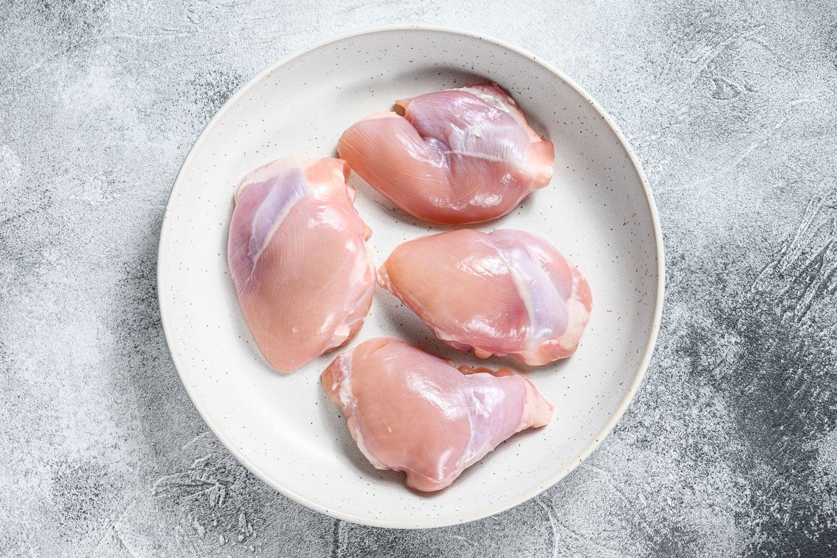 Raw Chicken Drumstick Fillet On Gray Background
