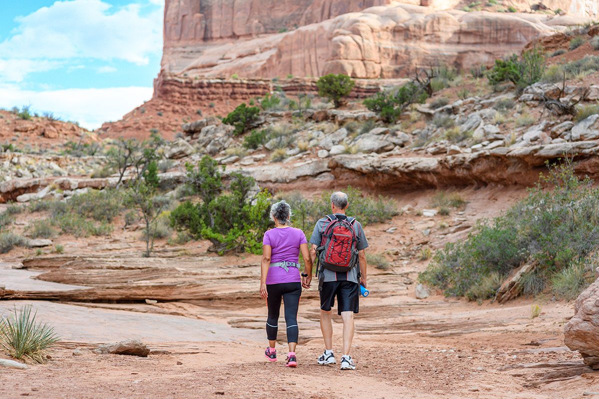 Active senior couple hiking in Utah