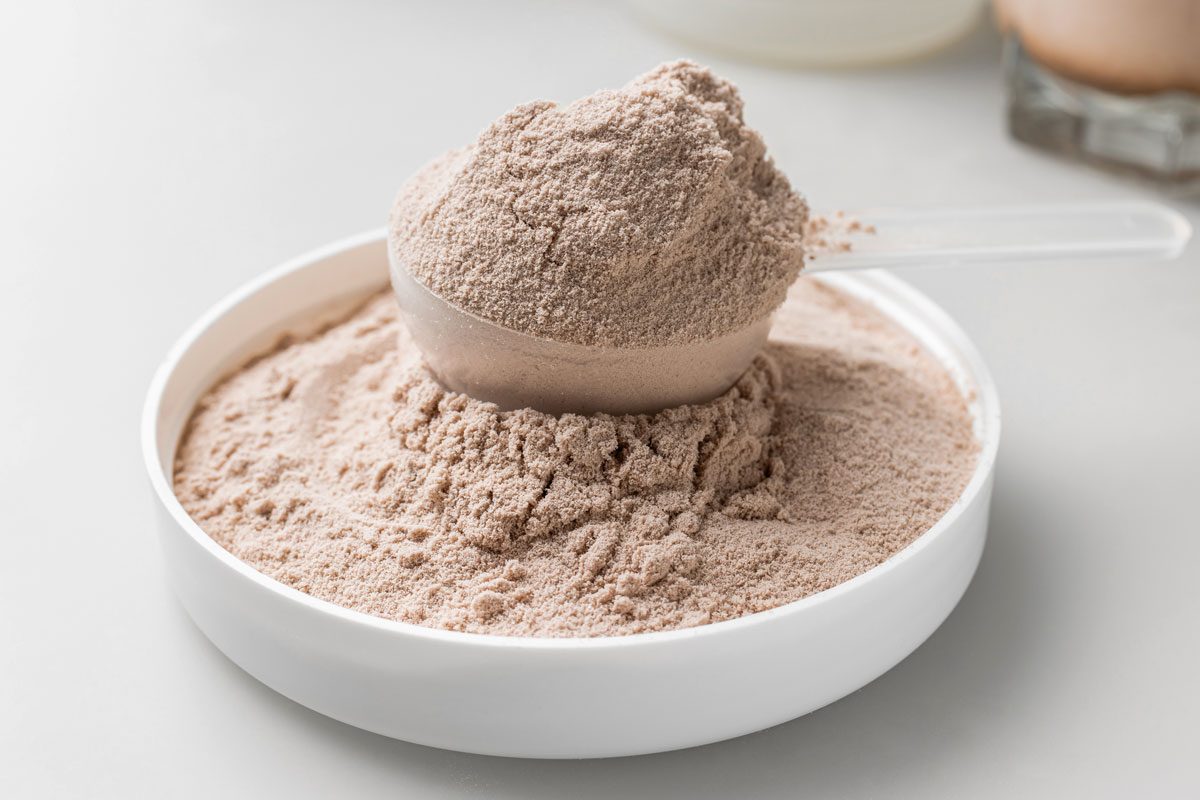 Whey Protein Powder In Measuring Scoop